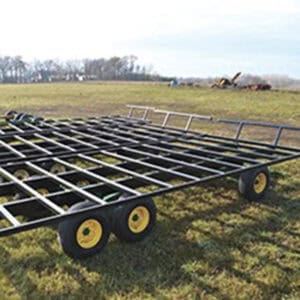 High-quality industrial trailer with durable frame and wheels for transportation of heavy machinery.