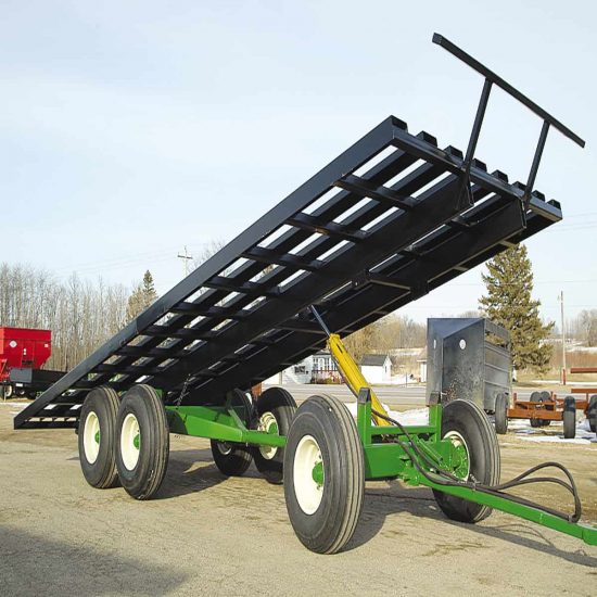 Durable black farming trailer with sturdy steel construction on a green chassis, ideal for agricultural transport.